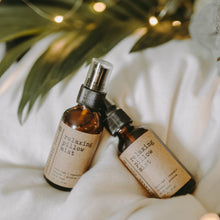 Load image into Gallery viewer, Relaxing essential oil pillow sprays on a white blanket next to a tree with lights.