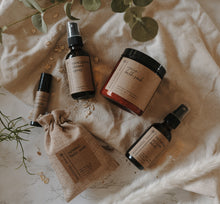 Load image into Gallery viewer, The spa gift set which includes a eucalyptus shower spray, organic lavender oatmeal bath soak, headache relief roller, essential oil &amp; herb revive bath soak and a relaxing pillow mist. The set is on a blanket in front of eucalyptus.
