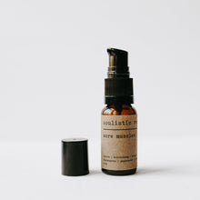 Load image into Gallery viewer, Arnica and essential oil sore muscle relief bottle with a lid off and a white background.
